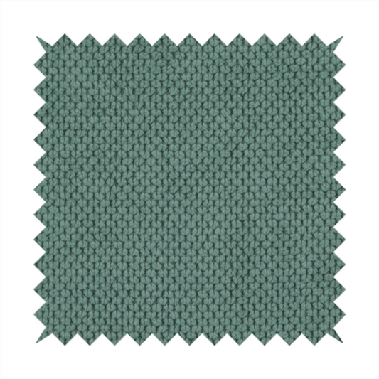 A premium teal or seafoam green fabric with a structured, three-dimensional waffle-knit or honeycomb texture for elegant interior design.