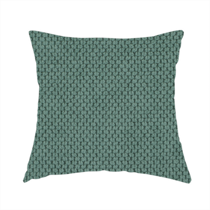 The fabric used to create this handmade cushion is a premium teal or seafoam green fabric with a structured, three-dimensional waffle-knit or honeycomb texture for elegant interior design.
