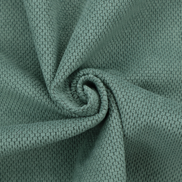 A premium teal or seafoam green fabric with a structured, three-dimensional waffle-knit or honeycomb texture for elegant interior design.