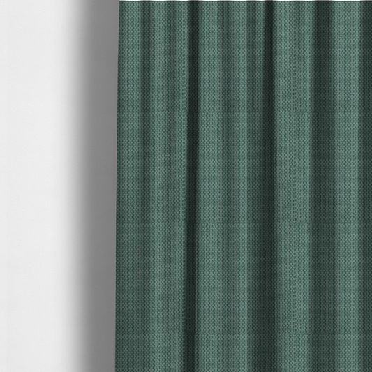 The fabric used to create these made-to-measure curtains is a premium teal or seafoam green fabric with a structured, three-dimensional waffle-knit or honeycomb texture for elegant interior design.