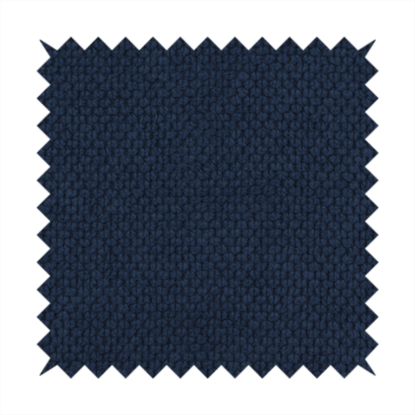 A premium deep navy blue waffle-knit fabric, highlighting a dense, three-dimensional honeycomb weave for luxury upholstery.
