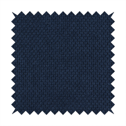 A premium deep navy blue waffle-knit fabric, highlighting a dense, three-dimensional honeycomb weave for luxury upholstery.