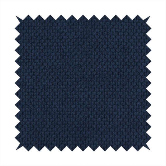 A premium deep navy blue waffle-knit fabric, highlighting a dense, three-dimensional honeycomb weave for luxury upholstery.