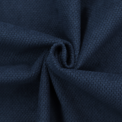 A premium deep navy blue waffle-knit fabric, highlighting a dense, three-dimensional honeycomb weave for luxury upholstery.
