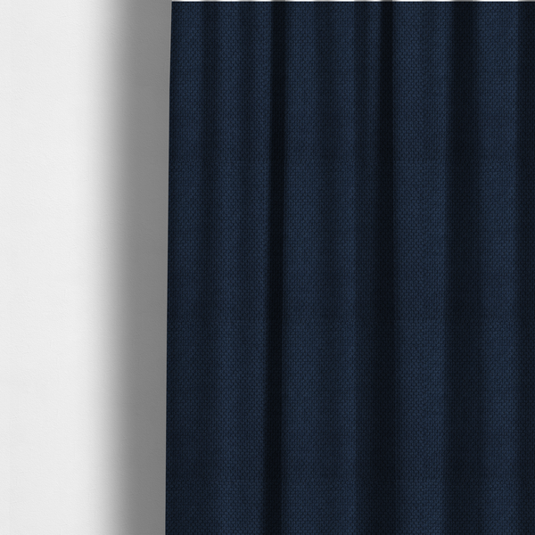 The fabric used to create these made-to-measure curtains is a premium deep navy blue waffle-knit fabric, highlighting a dense, three-dimensional honeycomb weave for luxury upholstery.