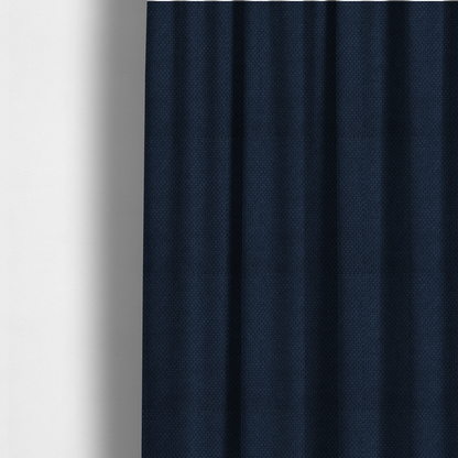 The fabric used to create these made-to-measure curtains is a premium deep navy blue waffle-knit fabric, highlighting a dense, three-dimensional honeycomb weave for luxury upholstery.