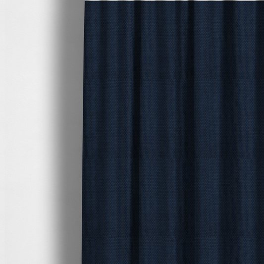 The fabric used to create these made-to-measure curtains is a premium deep navy blue waffle-knit fabric, highlighting a dense, three-dimensional honeycomb weave for luxury upholstery.