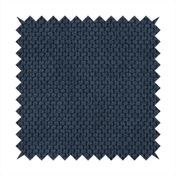 A premium navy blue waffle-knit fabric, highlighting a dense, three-dimensional honeycomb weave for luxury home decor.