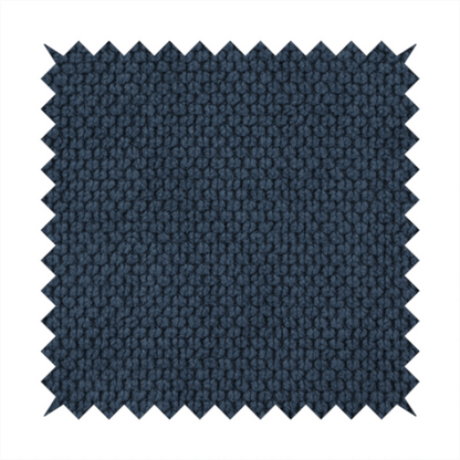 A premium navy blue waffle-knit fabric, highlighting a dense, three-dimensional honeycomb weave for luxury home decor.