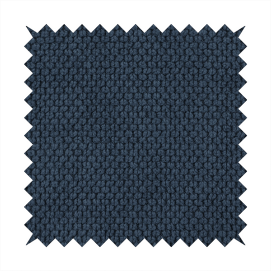 A premium navy blue waffle-knit fabric, highlighting a dense, three-dimensional honeycomb weave for luxury home decor.