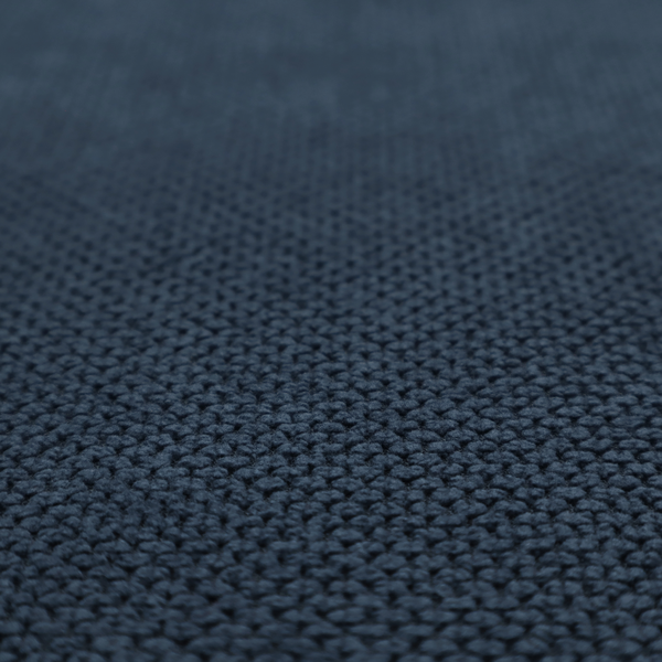 A premium navy blue waffle-knit fabric, highlighting a dense, three-dimensional honeycomb weave for luxury home decor.