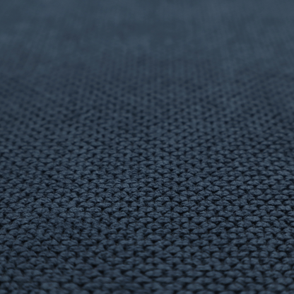 A premium navy blue waffle-knit fabric, highlighting a dense, three-dimensional honeycomb weave for luxury home decor.