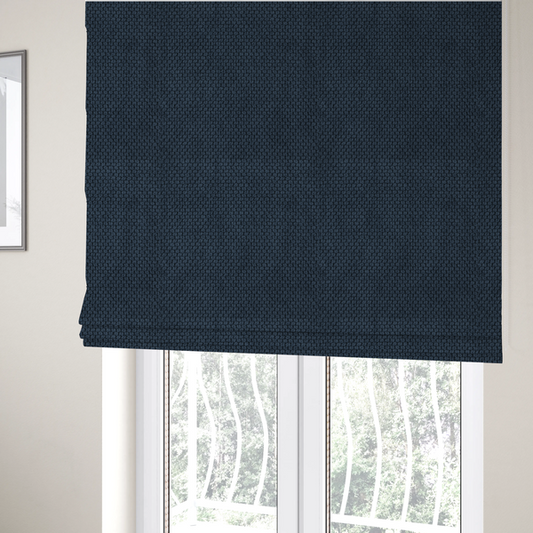 The fabric used to create these Roman blinds is a premium navy blue waffle-knit fabric, highlighting a dense, three-dimensional honeycomb weave for luxury home decor.