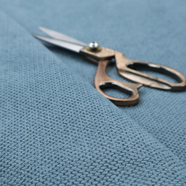 A premium light blue waffle-knit fabric, featuring a crisp, textured honeycomb weave ideal for contemporary home upholstery.