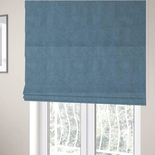 The fabric used to create these Roman blinds is a  premium light blue waffle-knit fabric, featuring a crisp, textured honeycomb weave ideal for contemporary home upholstery.