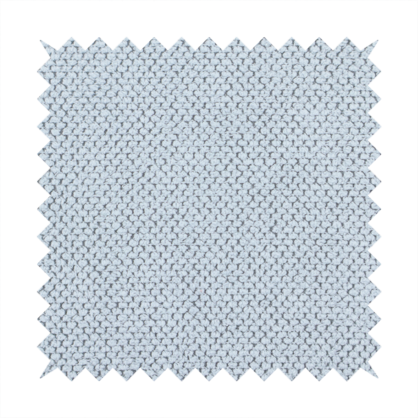 A premium pale ice blue waffle-knit fabric, showcasing a crisp, structured, and sophisticated honeycomb texture.