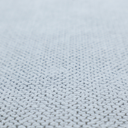A premium pale ice blue waffle-knit fabric, showcasing a crisp, structured, and sophisticated honeycomb texture.