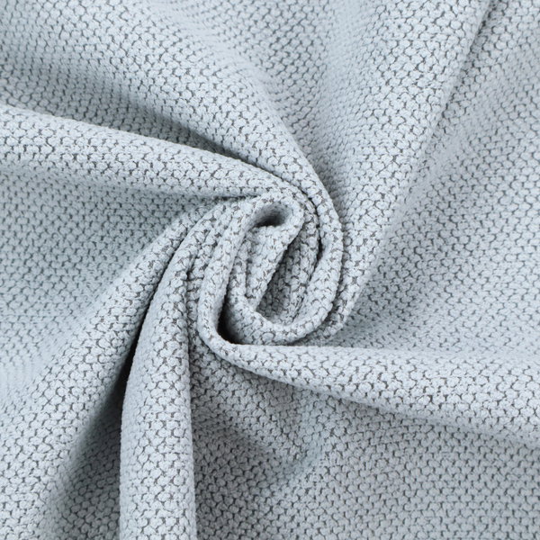 A premium pale ice blue waffle-knit fabric, showcasing a crisp, structured, and sophisticated honeycomb texture.