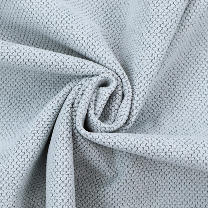 A premium pale ice blue waffle-knit fabric, showcasing a crisp, structured, and sophisticated honeycomb texture.