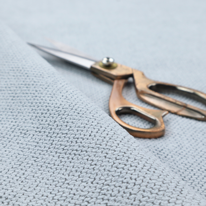 A premium pale ice blue waffle-knit fabric, showcasing a crisp, structured, and sophisticated honeycomb texture.