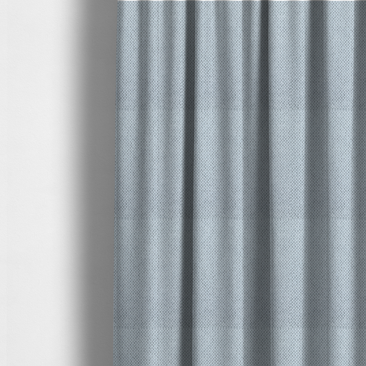 The fabric used to create these made-to-measure curtains is a premium pale ice blue waffle-knit fabric, showcasing a crisp, structured, and sophisticated honeycomb texture.
