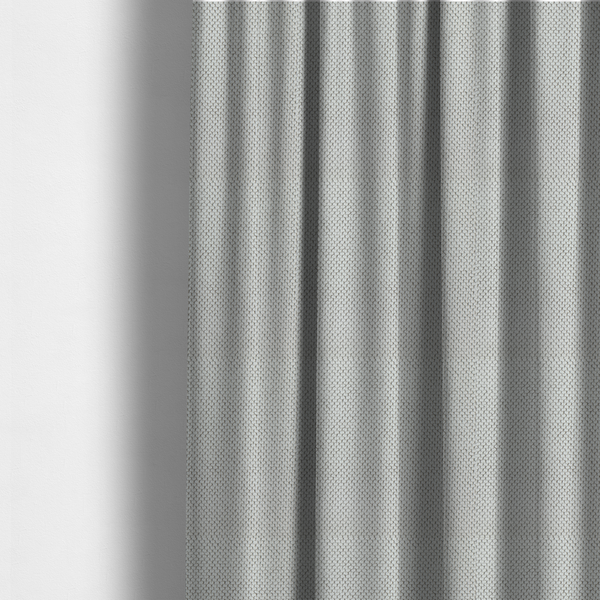 The fabric used to create these made-to-measure curtains is a premium light grey or off-white waffle-knit fabric, featuring a crisp, structured, and sophisticated honeycomb texture.