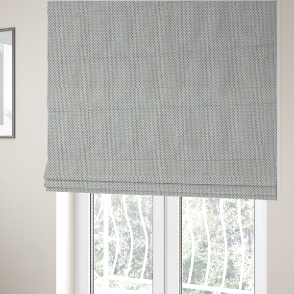 The fabric used to create these Roman blinds is a premium light grey or off-white waffle-knit fabric, featuring a crisp, structured, and sophisticated honeycomb texture.