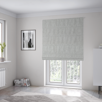The fabric used to create these Roman blinds is a premium light grey or off-white waffle-knit fabric, featuring a crisp, structured, and sophisticated honeycomb texture.