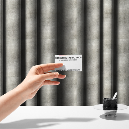 The fabric used to create these made-to-measure curtains is a premium off-white/cream waffle-knit fabric, featuring a crisp, clean, three-dimensional honeycomb weave with a soft finish.