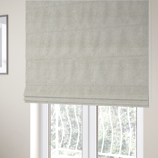 The fabric used to create these Roman blinds is a premium off-white/cream waffle-knit fabric, featuring a crisp, clean, three-dimensional honeycomb weave with a soft finish.