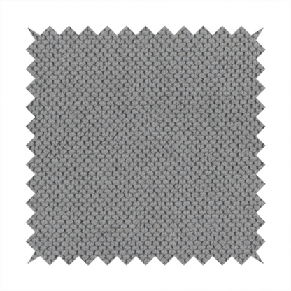 A light grey upholstery fabric. The material features a tightly woven, multidimensional texture that creates a soft, grainy appearance across the entire surface.