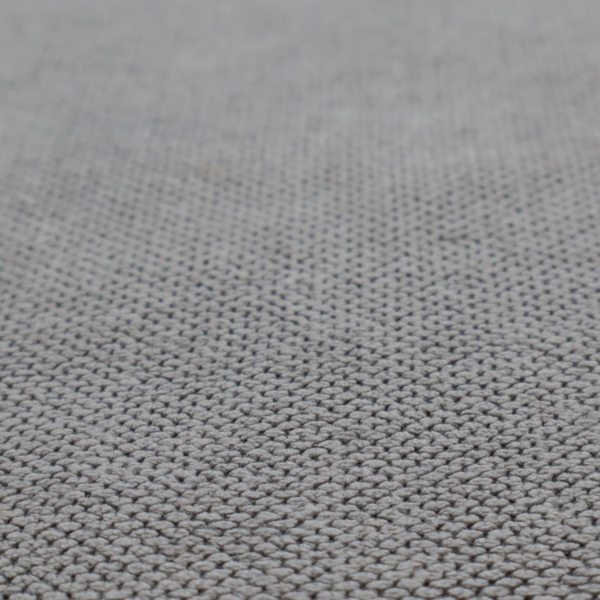 A light grey upholstery fabric. The material features a tightly woven, multidimensional texture that creates a soft, grainy appearance across the entire surface.