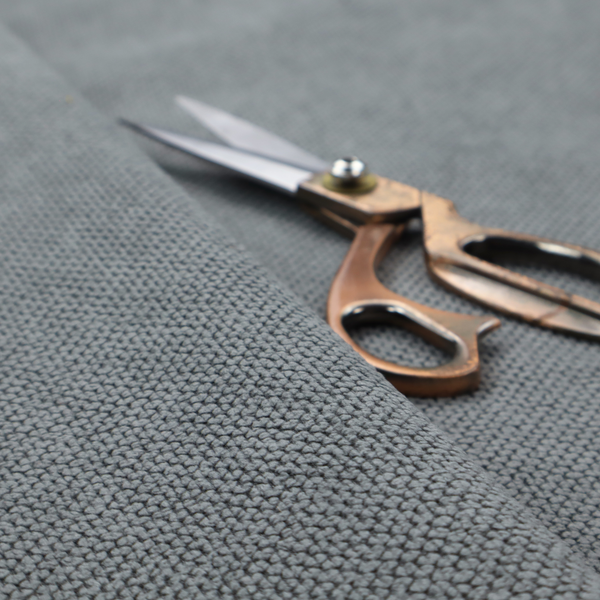 A premium cool grey waffle-knit fabric, featuring a crisp, clean, three-dimensional honeycomb weave.