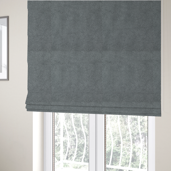 The fabric used to create these Roman blinds is a premium cool grey waffle-knit fabric, featuring a crisp, clean, three-dimensional honeycomb weave.