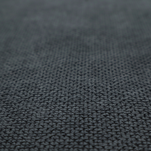 A premium charcoal grey waffle-knit fabric, featuring a dense, three-dimensional honeycomb weave for a sophisticated, modern aesthetic.
