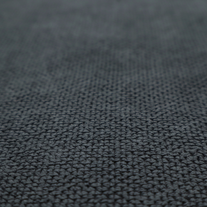 A premium charcoal grey waffle-knit fabric, featuring a dense, three-dimensional honeycomb weave for a sophisticated, modern aesthetic.