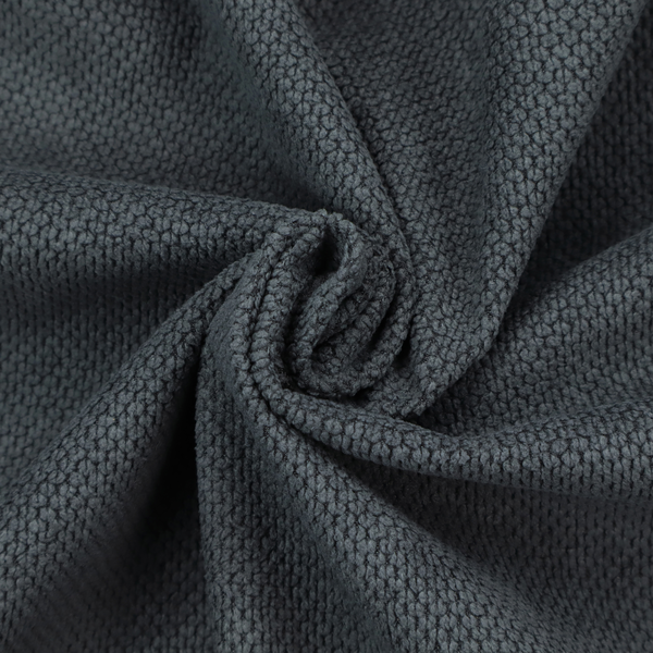 A premium charcoal grey waffle-knit fabric, featuring a dense, three-dimensional honeycomb weave for a sophisticated, modern aesthetic.