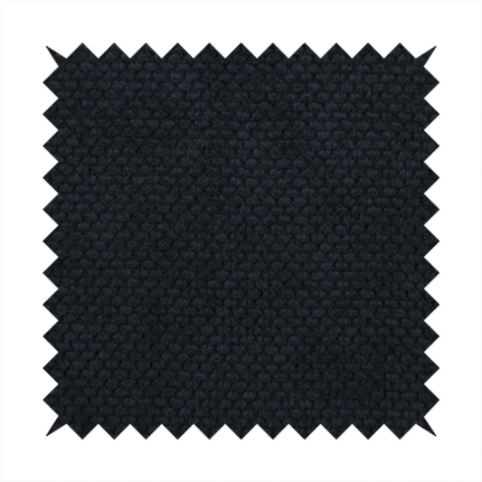 A premium midnight black waffle-knit fabric, showcasing a refined, dense, and uniform three-dimensional honeycomb texture.