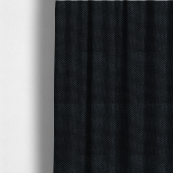 The fabric used to create these made-to-measure curtains is a premium midnight black waffle-knit fabric, showcasing a refined, dense, and uniform three-dimensional honeycomb texture.