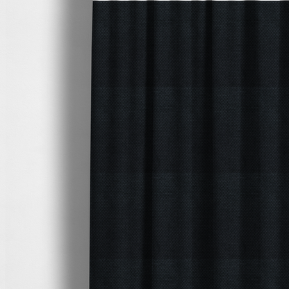 The fabric used to create these made-to-measure curtains is a premium midnight black waffle-knit fabric, showcasing a refined, dense, and uniform three-dimensional honeycomb texture.