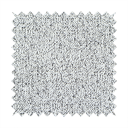 A textured white fabric with an intricate, irregular black speckled pattern throughout.