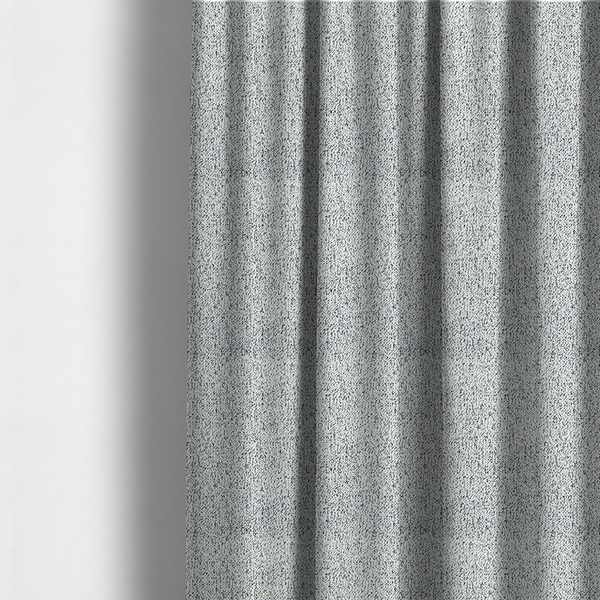 The fabric used to create these made-to-measure curtains is a textured white fabric with an intricate, irregular black speckled pattern throughout.