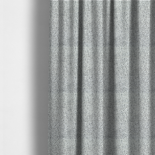 The fabric used to create these made-to-measure curtains is a textured white fabric with an intricate, irregular black speckled pattern throughout.