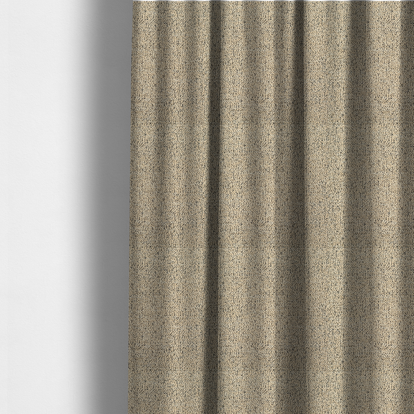 The fabric used to create these made-to-measure curtains is a beige textured fabric with a dense, irregular black speckled pattern.