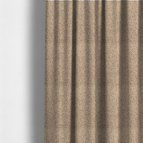 The fabric used to create these made-to-measure curtains is a tan textured fabric with a dense, irregular black speckled pattern.
