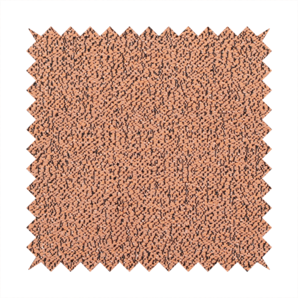 A terracotta orange textured fabric with a dense, irregular black speckled pattern.