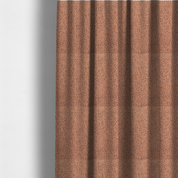 The fabric used to create these made-to-measure curtains is a terracotta orange textured fabric with a dense, irregular black speckled pattern.