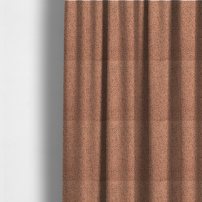 The fabric used to create these made-to-measure curtains is a terracotta orange textured fabric with a dense, irregular black speckled pattern.