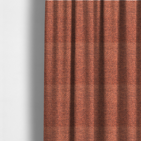 The fabric used to create these made-to-measure curtains is a coral textured fabric with a dense, irregular black speckled pattern.