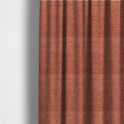 The fabric used to create these made-to-measure curtains is a coral textured fabric with a dense, irregular black speckled pattern.
